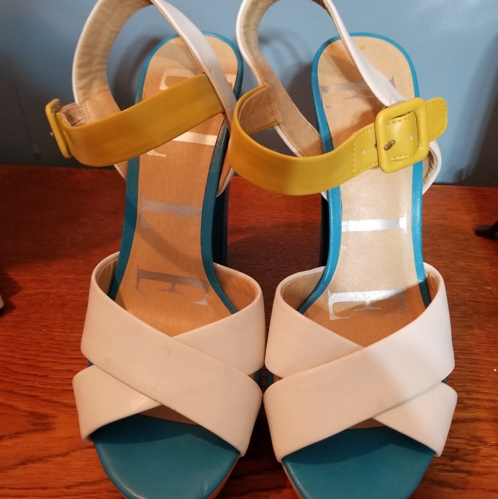 Elle heals - blue yellow white and orange.